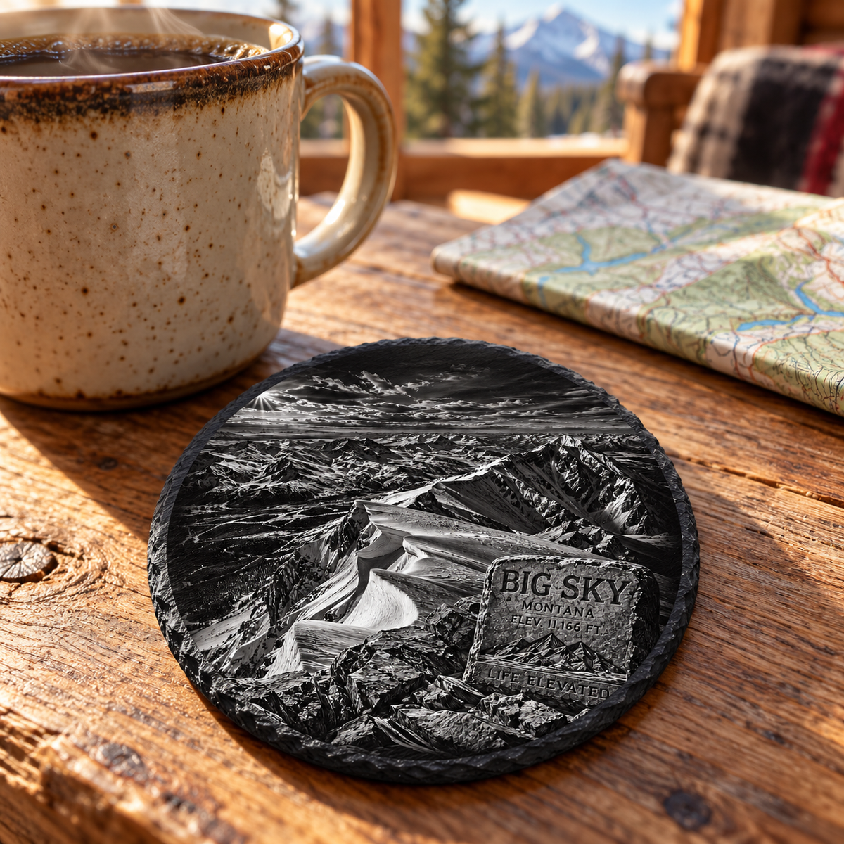 Lone Peak Summit View Slate Coaster — lifestyle view of the engraved black slate coaster on a cabin table.