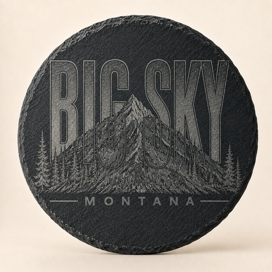 Full-face Big Sky Heritage engraving on a four-inch round slate coaster
