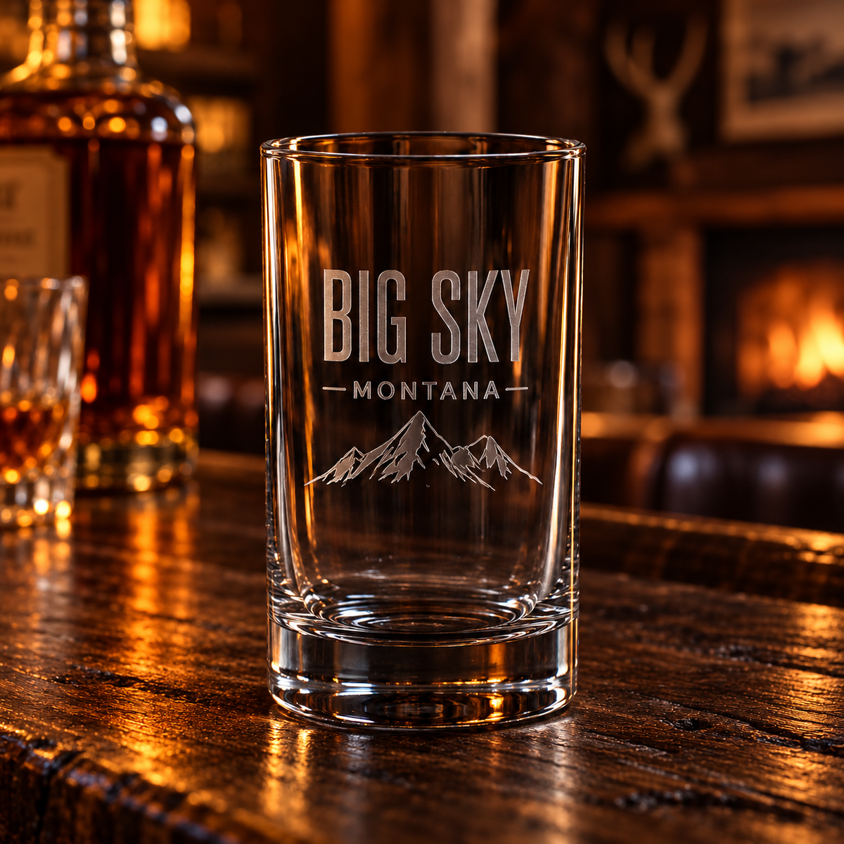 Big Sky Shadow shot glass on a warm-lit lodge bar