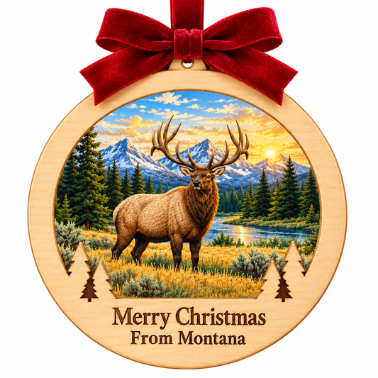 Yellowstone Elk Light-Up Ornament in locked pale wood frame with red bow, paired evergreen cutouts, and engraved Merry Christmas From Montana plaque